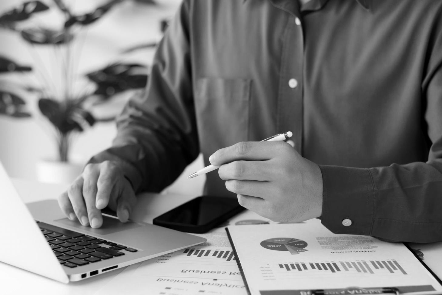 Business owner reviewing financial documents and planning growth strategies